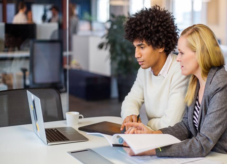 Business partners reviewing buy-sell agreement